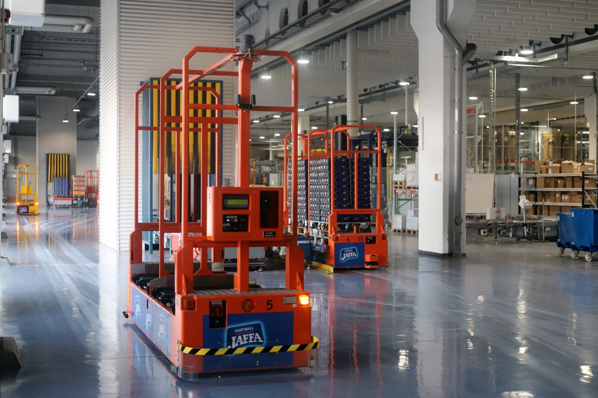 AGVs moving beverage pallets at Hartwall facilities